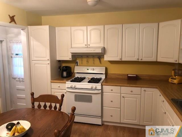 17 Brox Road Edison, NJ 08817 - Photo 2 of 11 a kitchen with cabinets and appliances