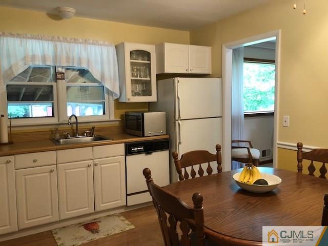 17 Brox Road Edison, NJ 08817 - Photo 3 of 11 a kitchen with stainless steel appliances granite countertop a sink a stove and a refrigerator