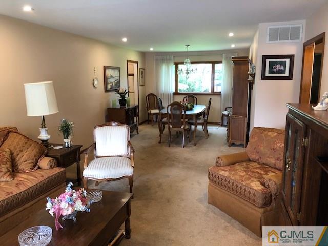 17 Brox Road Edison, NJ 08817 - Photo 4 of 11 a living room with furniture couches and a flat screen tv