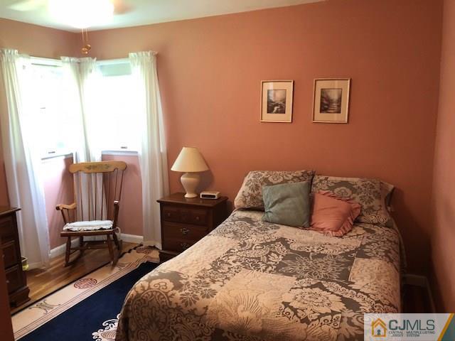 17 Brox Road Edison, NJ 08817 - Photo 8 of 11 a bed sitting in a bedroom next to a window