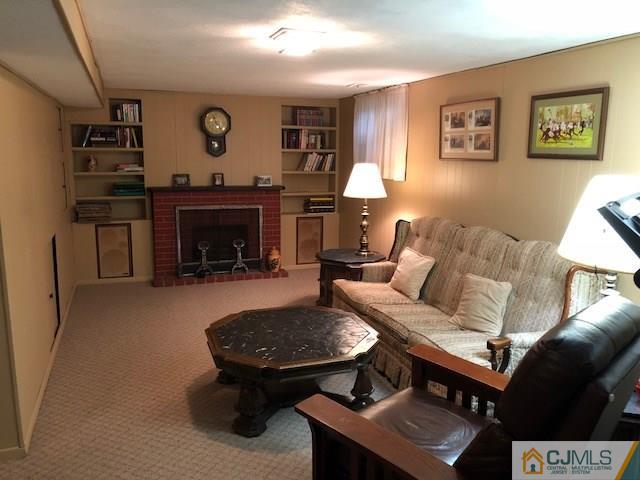 17 Brox Road Edison, NJ 08817 - Photo 9 of 11 a living room with furniture and a fireplace