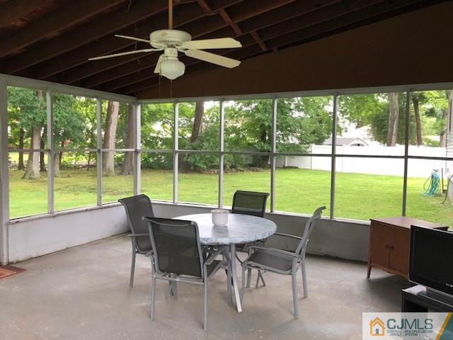 17 Brox Road Edison, NJ 08817 - Photo 10 of 11 a view of a patio with a table chairs and a backyard