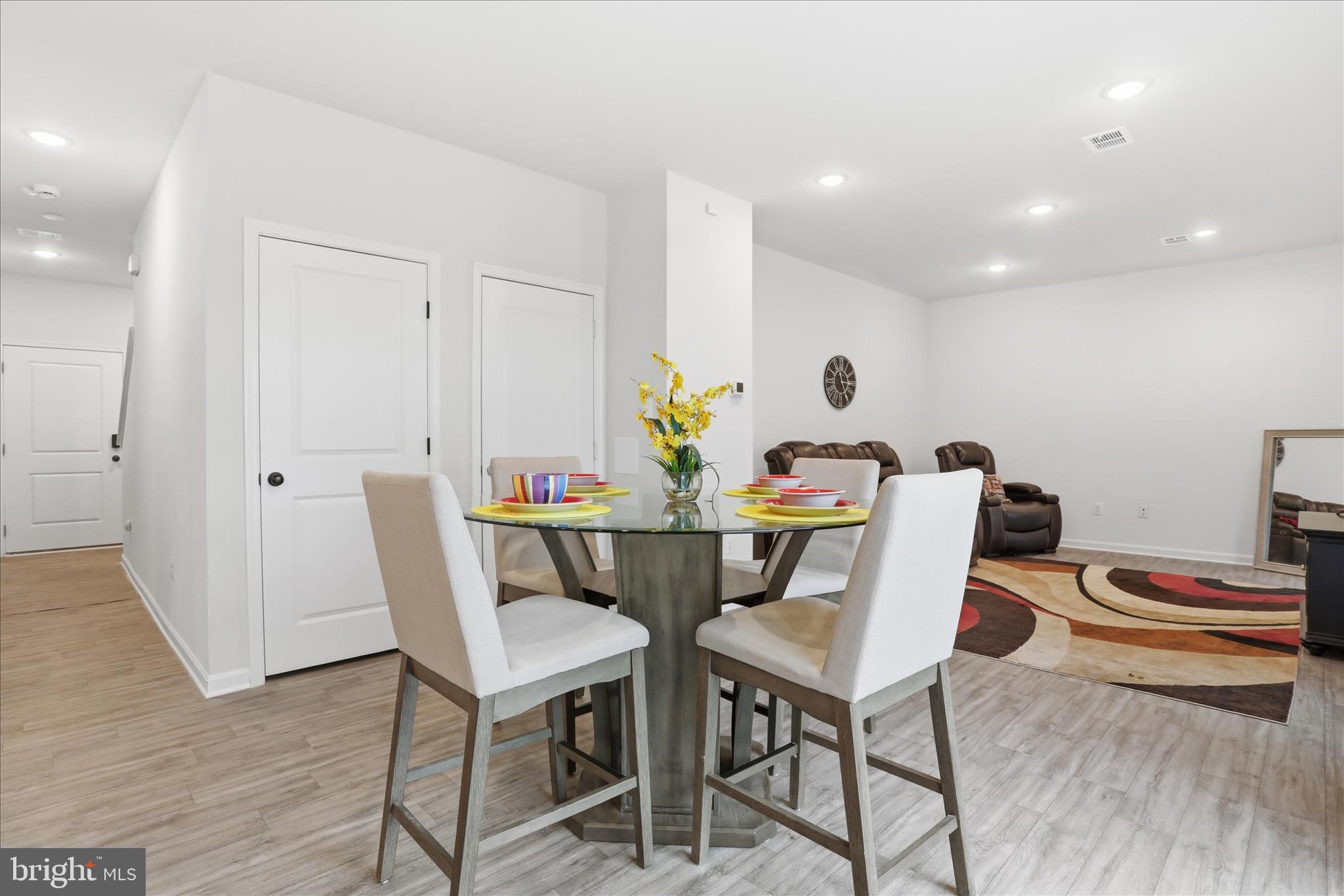 76 Diving Scaup Road Hedgesville, WV 25427 - Photo 11 of 48 a view of a dining room with furniture and wooden floor