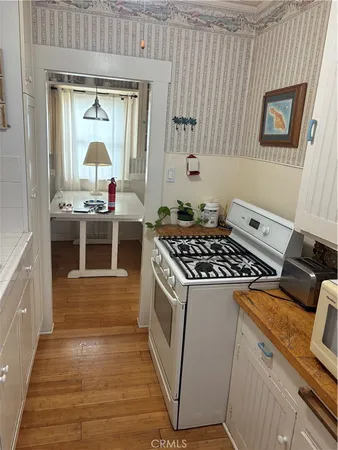 a kitchen with a stove and a refrigerator
