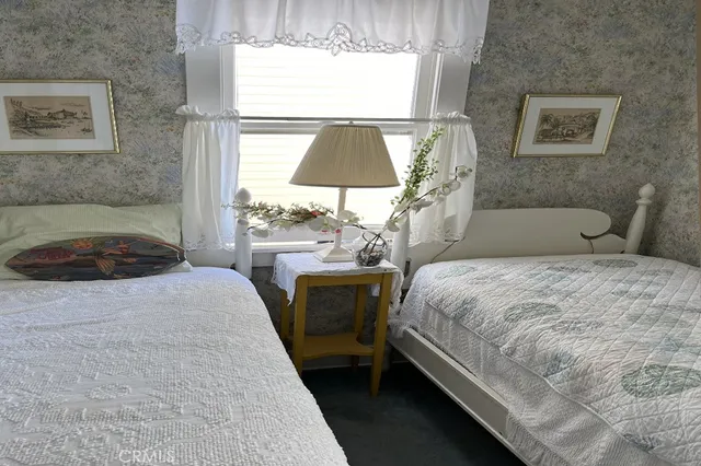 a bedroom with a bed and a lamp