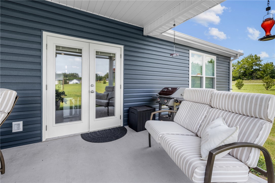 422 Mountain View Church Road Six Mile, SC 29682 - Photo 33 of 40 An inviting covered patio, perfect for grilling and outdoor relaxation, complements this home's exterior.