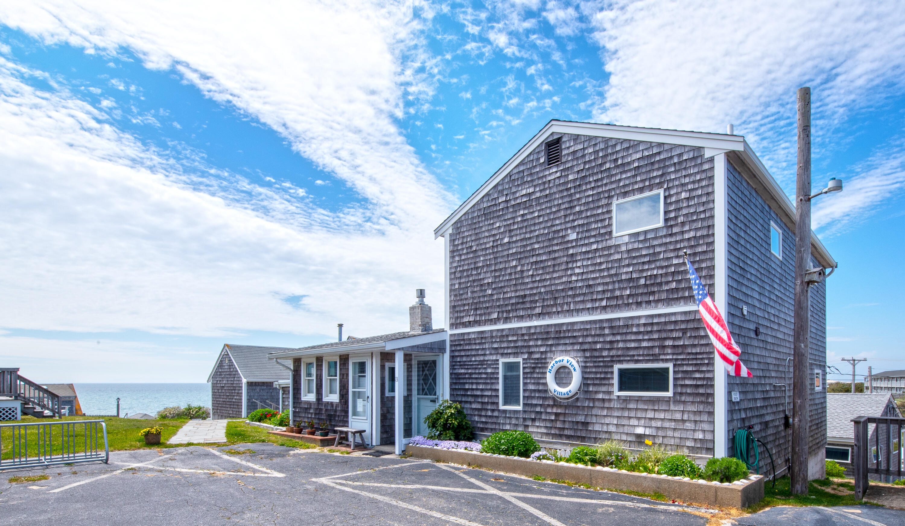 168 Shore Road, Unit 13 Truro, MA 02666 - Photo 1 of 28 a view of a brick building next to a yard