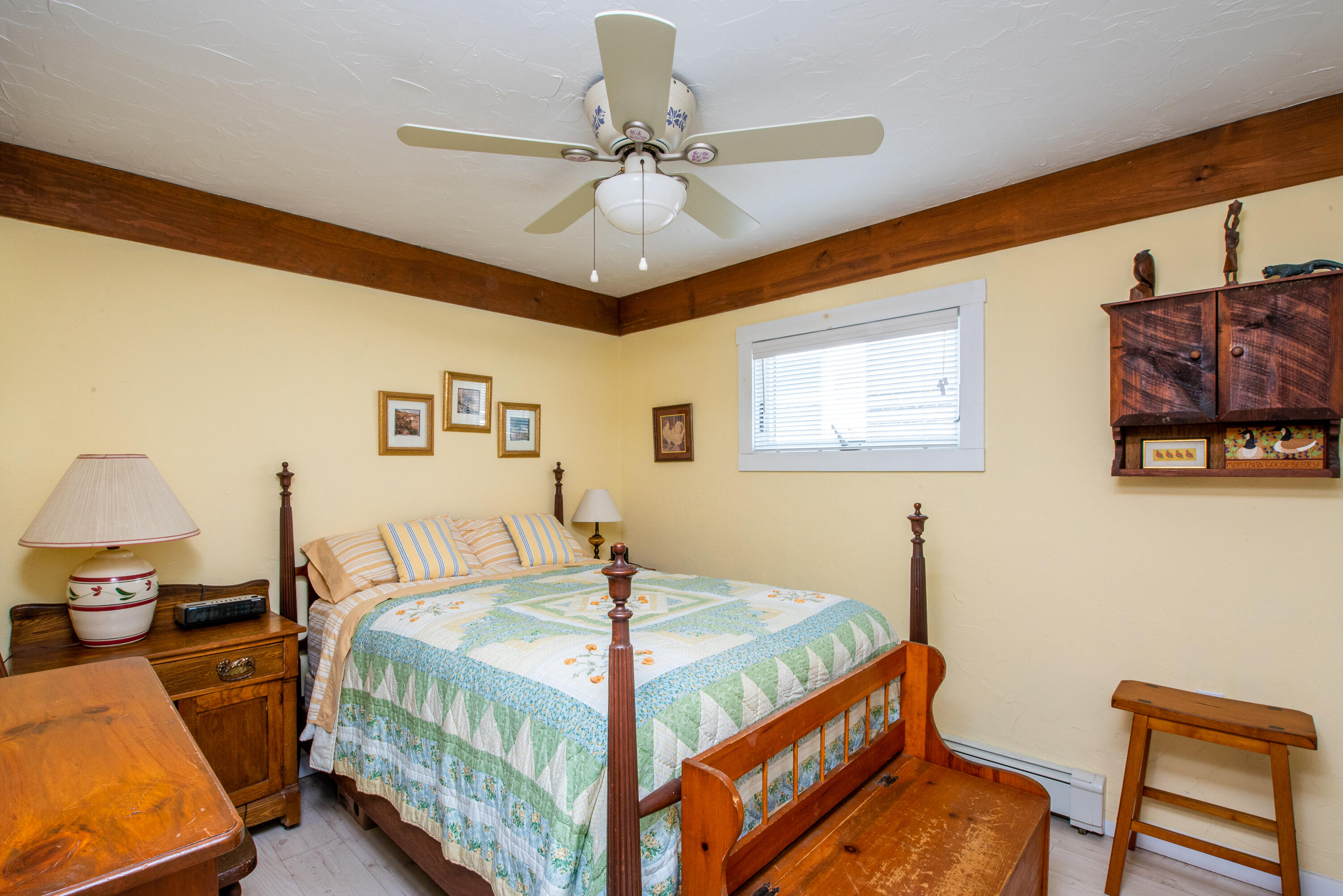 168 Shore Road, Unit 13 Truro, MA 02666 - Photo 14 of 28 a bedroom with a bed and a table in it