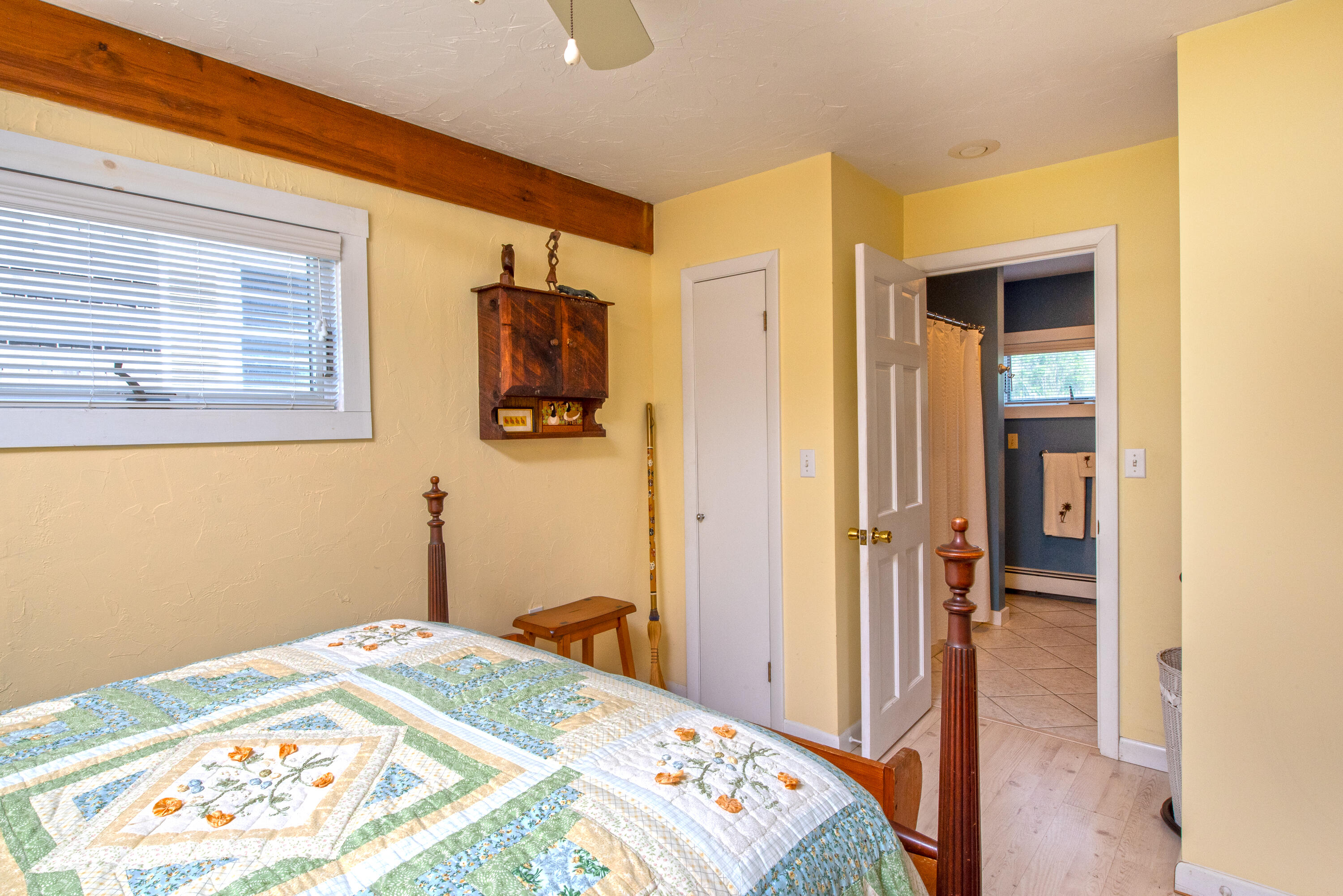 168 Shore Road, Unit 13 Truro, MA 02666 - Photo 15 of 28 a view of a hallway with wooden floor and a bathroom