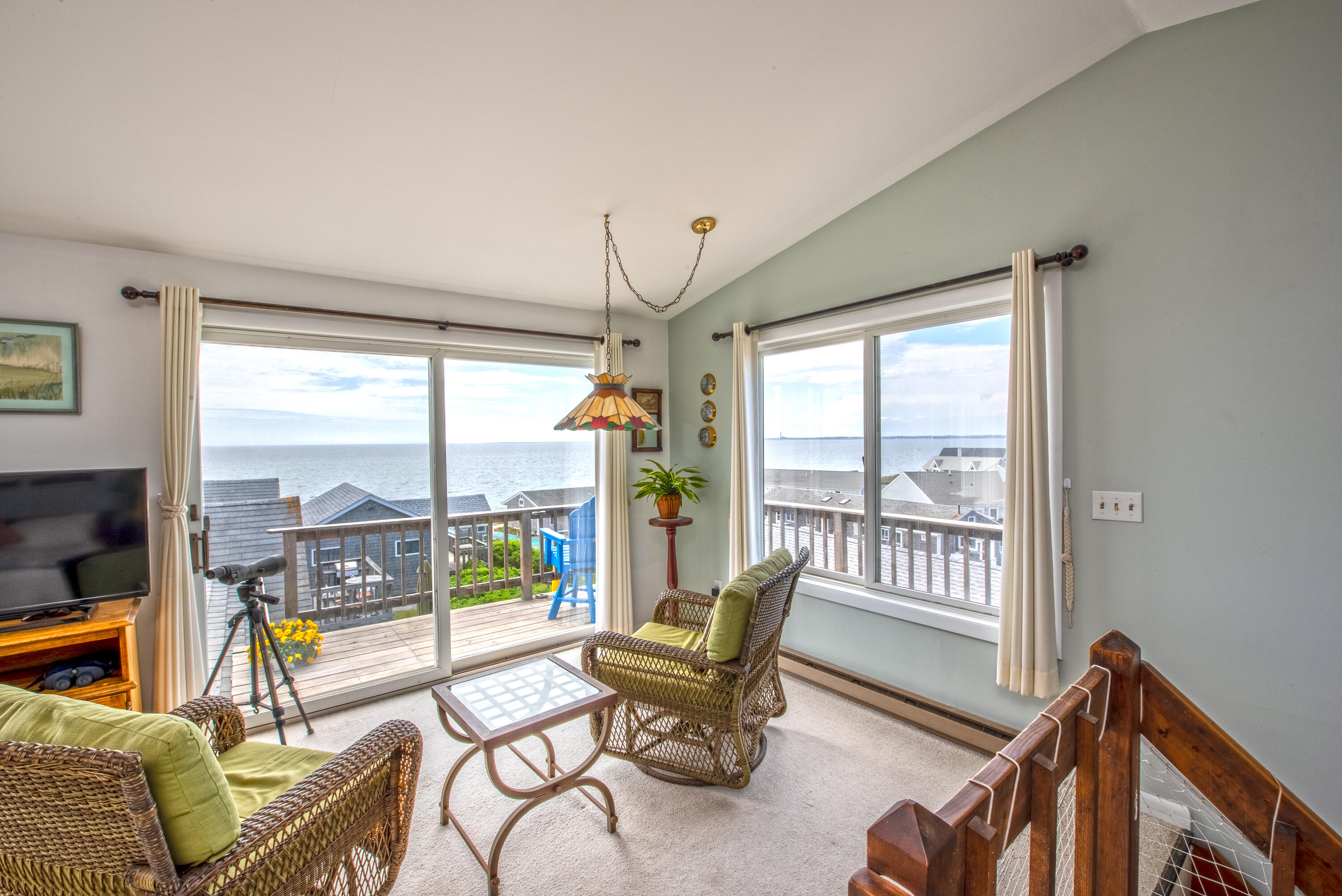 168 Shore Road, Unit 13 Truro, MA 02666 - Photo 20 of 28 a living room with furniture and floor to ceiling windows