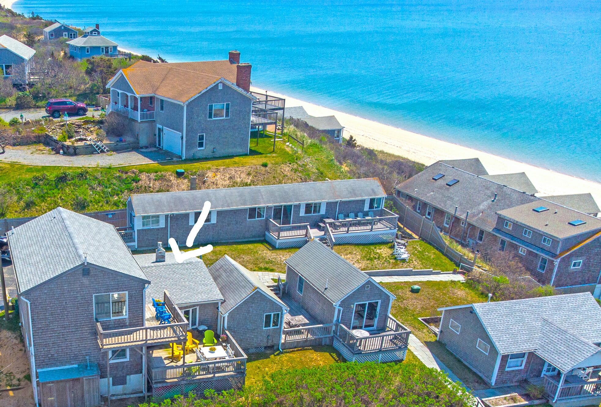 168 Shore Road, Unit 13 Truro, MA 02666 - Photo 2 of 28 an aerial view of residential houses with outdoor space and swimming pool