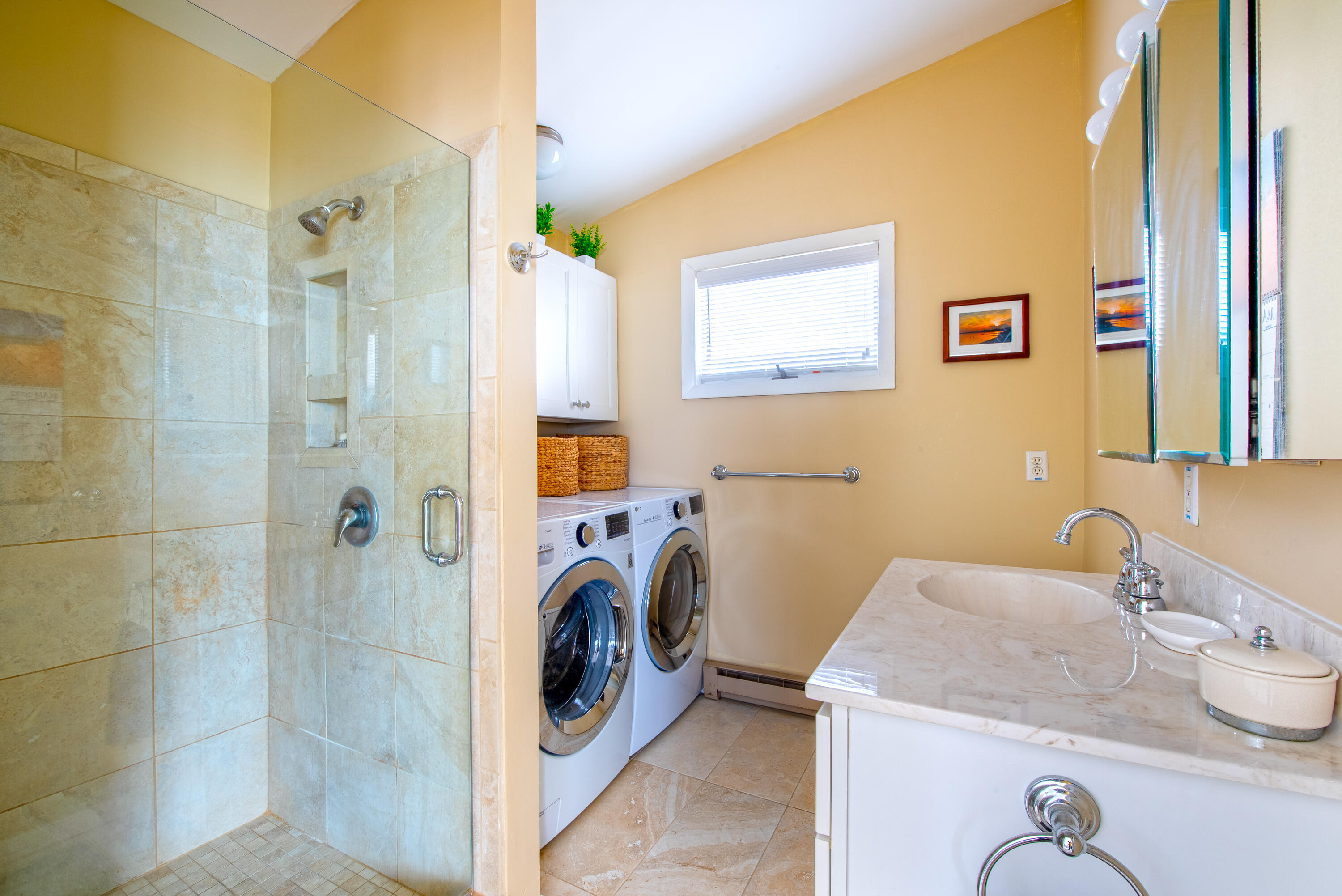 168 Shore Road, Unit 13 Truro, MA 02666 - Photo 24 of 28 a bathroom with a sink a washer and dryer