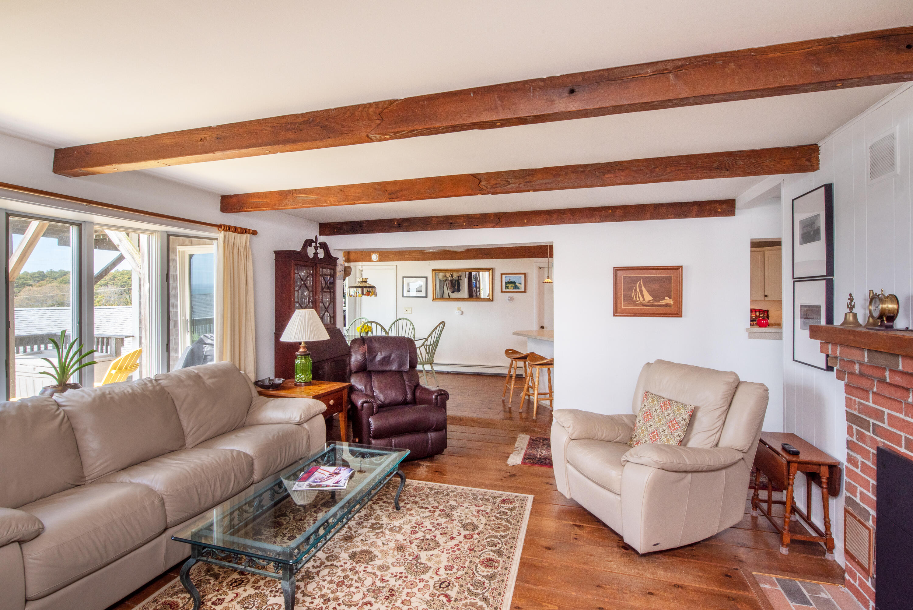 168 Shore Road, Unit 13 Truro, MA 02666 - Photo 4 of 28 a living room with furniture and a large window