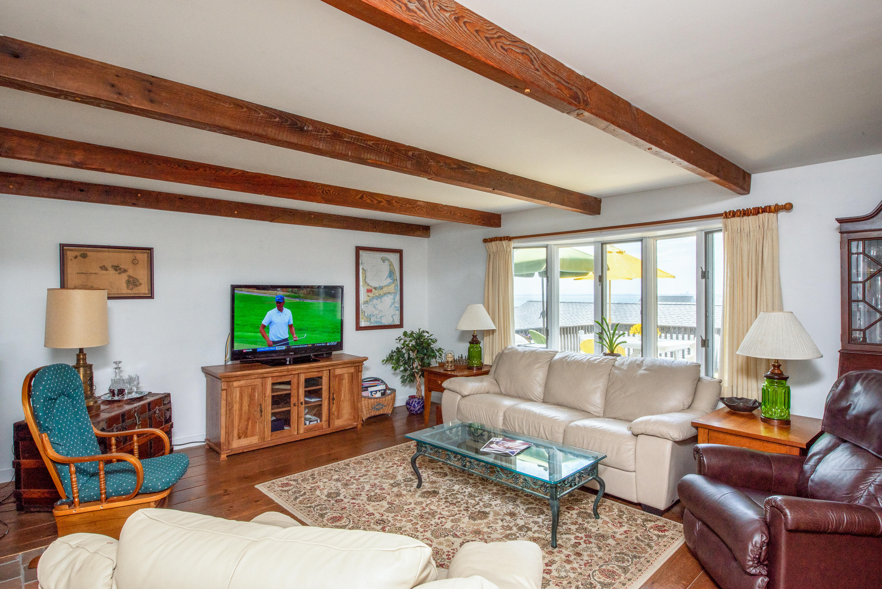 168 Shore Road, Unit 13 Truro, MA 02666 - Photo 5 of 28 a living room with furniture and a flat screen tv
