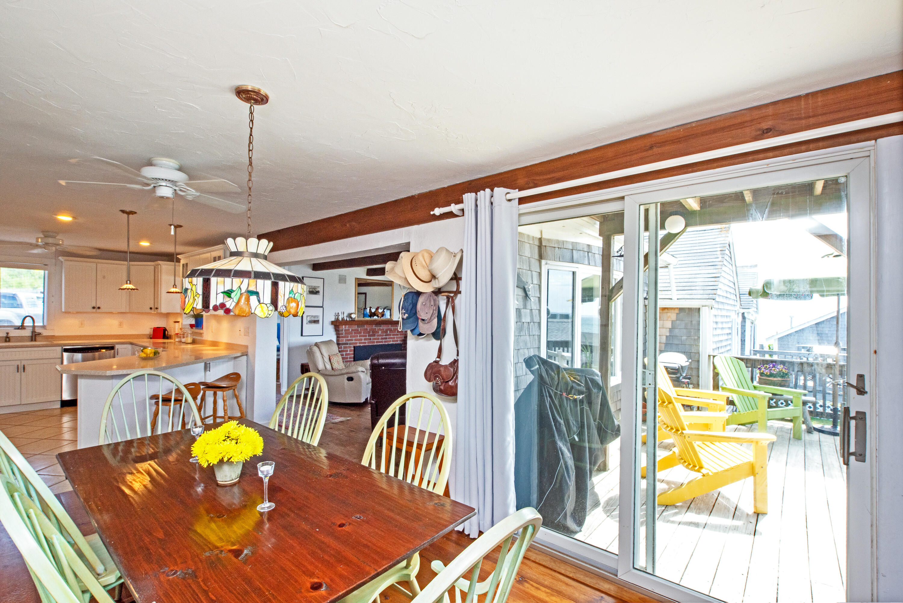 168 Shore Road, Unit 13 Truro, MA 02666 - Photo 7 of 28 a view of a dining room with furniture a chandelier and wooden floor