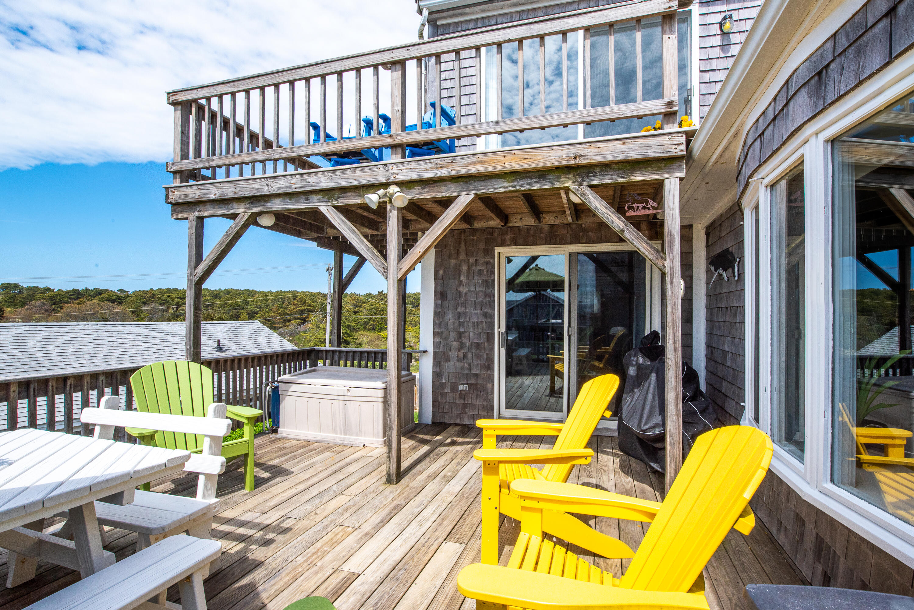 168 Shore Road, Unit 13 Truro, MA 02666 - Photo 9 of 28 a view of a chair and tables in the balcony