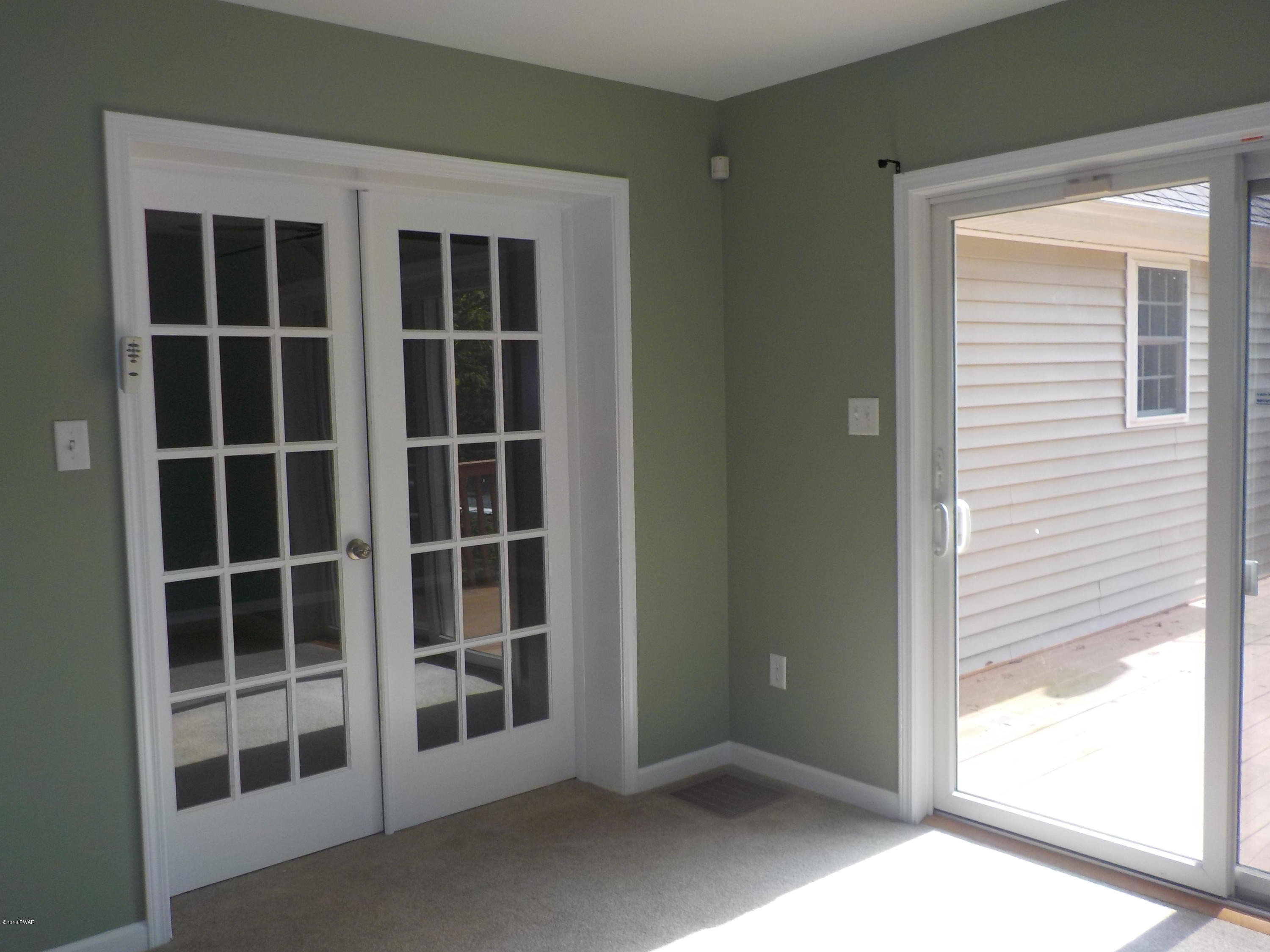 230 Maple Ridge Drive Hawley, PA 18428 - Photo 12 of 35 a view of an empty room with a window
