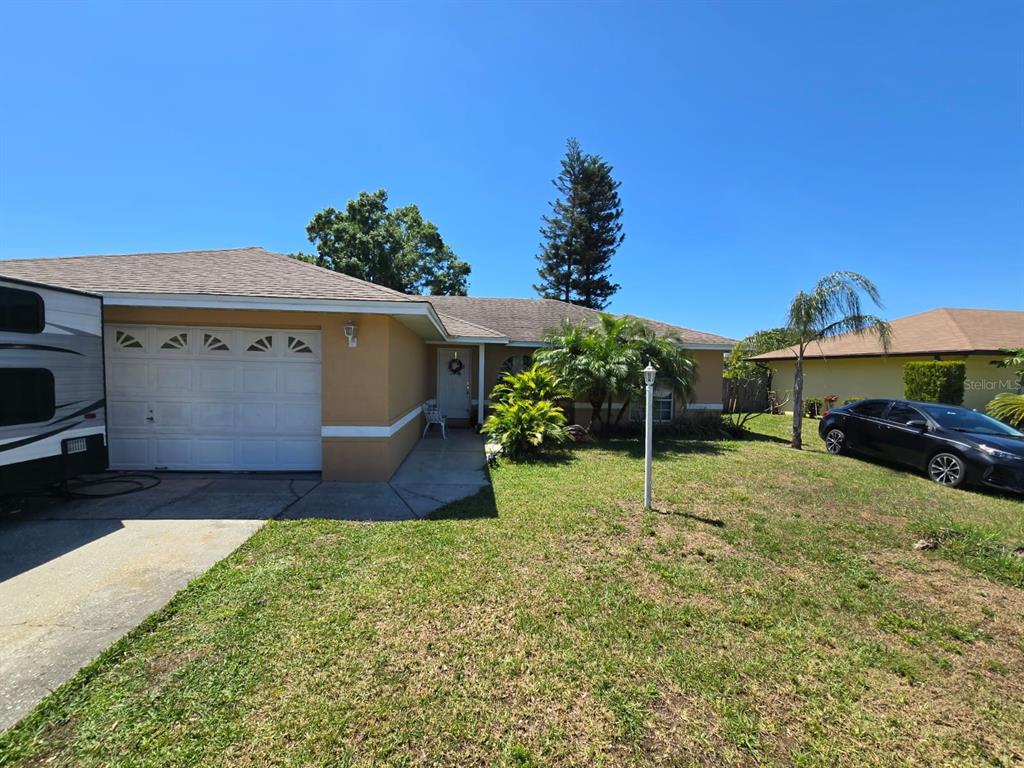7818 Lewis Road Lakeland, FL 33810 - Photo 2 of 13 a house view with a garden space