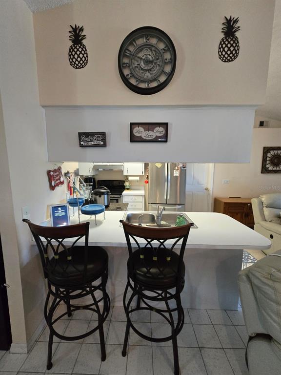 7818 Lewis Road Lakeland, FL 33810 - Photo 4 of 13 a dining area with a table and chairs