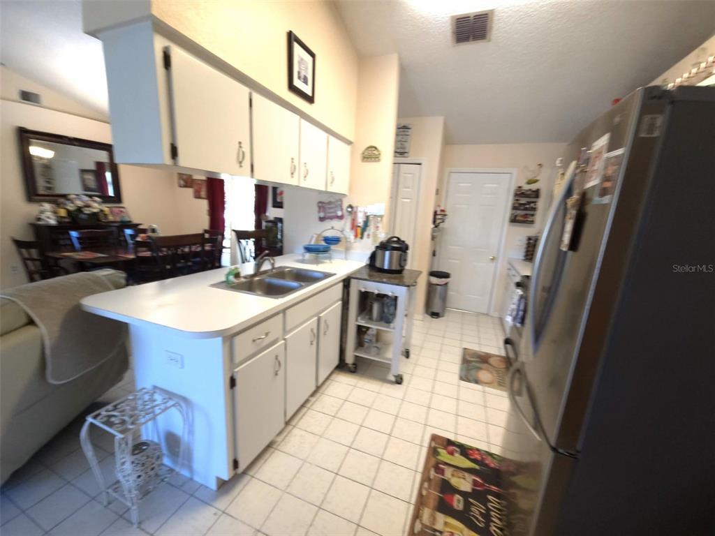 7818 Lewis Road Lakeland, FL 33810 - Photo 6 of 13 a kitchen with a sink stove and cabinets