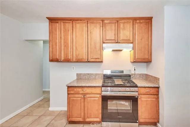 a kitchen with a sink cabinets and window