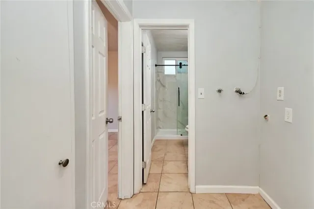 a view of a bathroom with a glass shower door