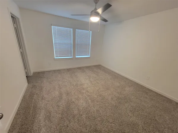 a utility room with cabinets washer and dryer
