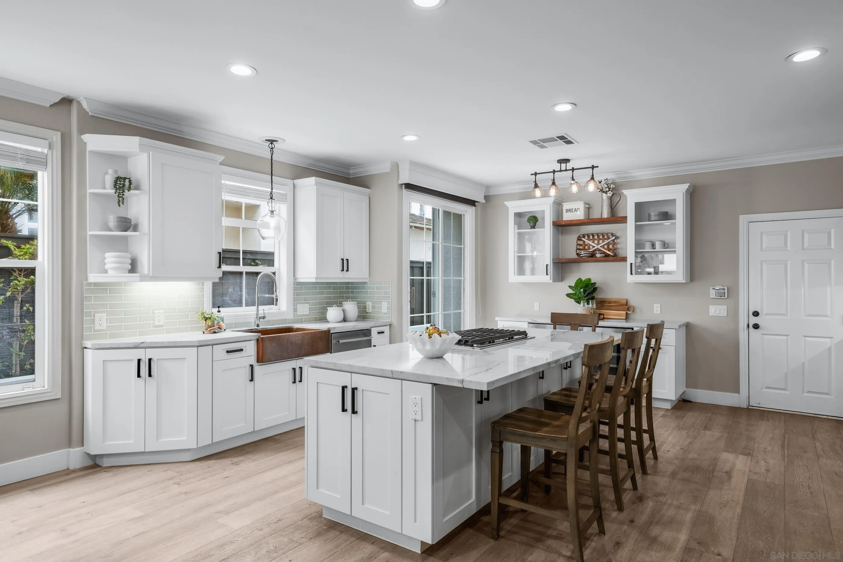6402 Topmast Drive Carlsbad, CA 92011 - Photo 17 of 53 a kitchen that has a table and chairs in it