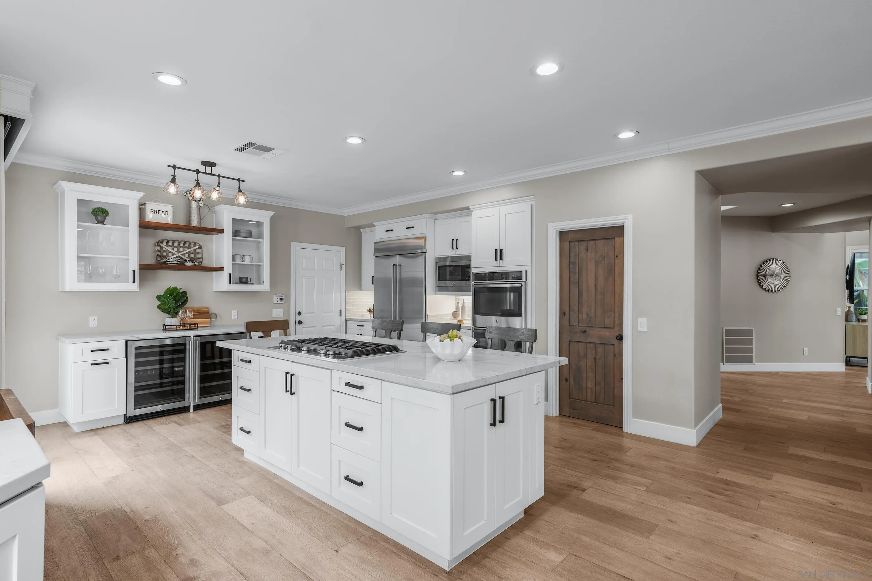 6402 Topmast Drive Carlsbad, CA 92011 - Photo 21 of 53 a kitchen with stainless steel appliances granite countertop a stove oven and a refrigerator