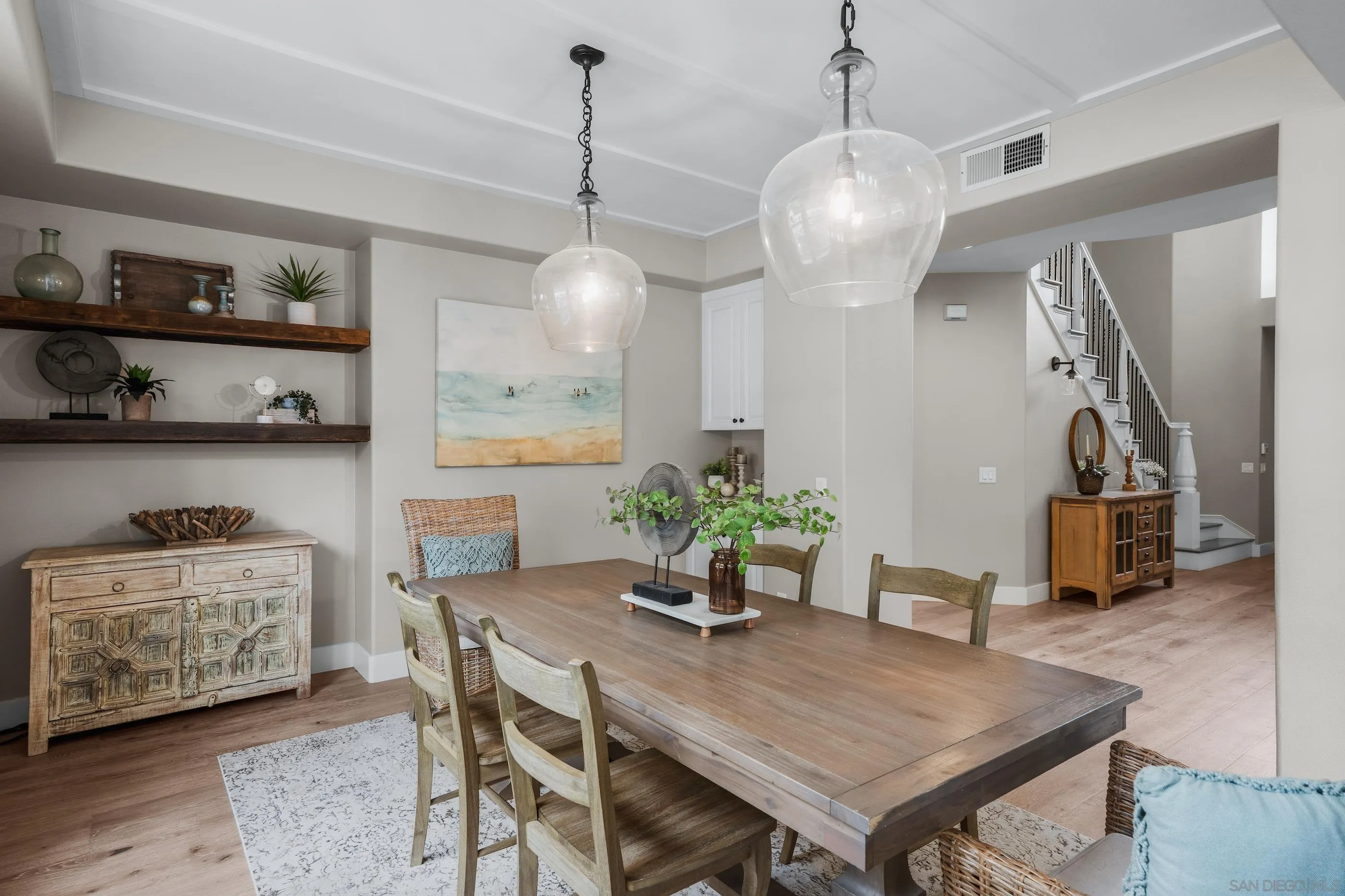 6402 Topmast Drive Carlsbad, CA 92011 - Photo 27 of 53 a dining room with furniture and wooden floor