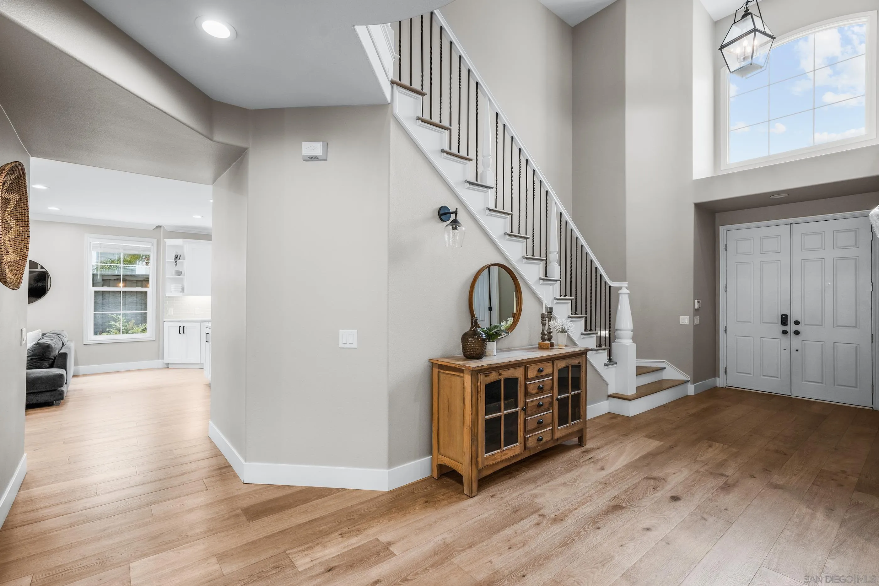 6402 Topmast Drive Carlsbad, CA 92011 - Photo 28 of 53 a view of a livingroom with wooden floor and staircase