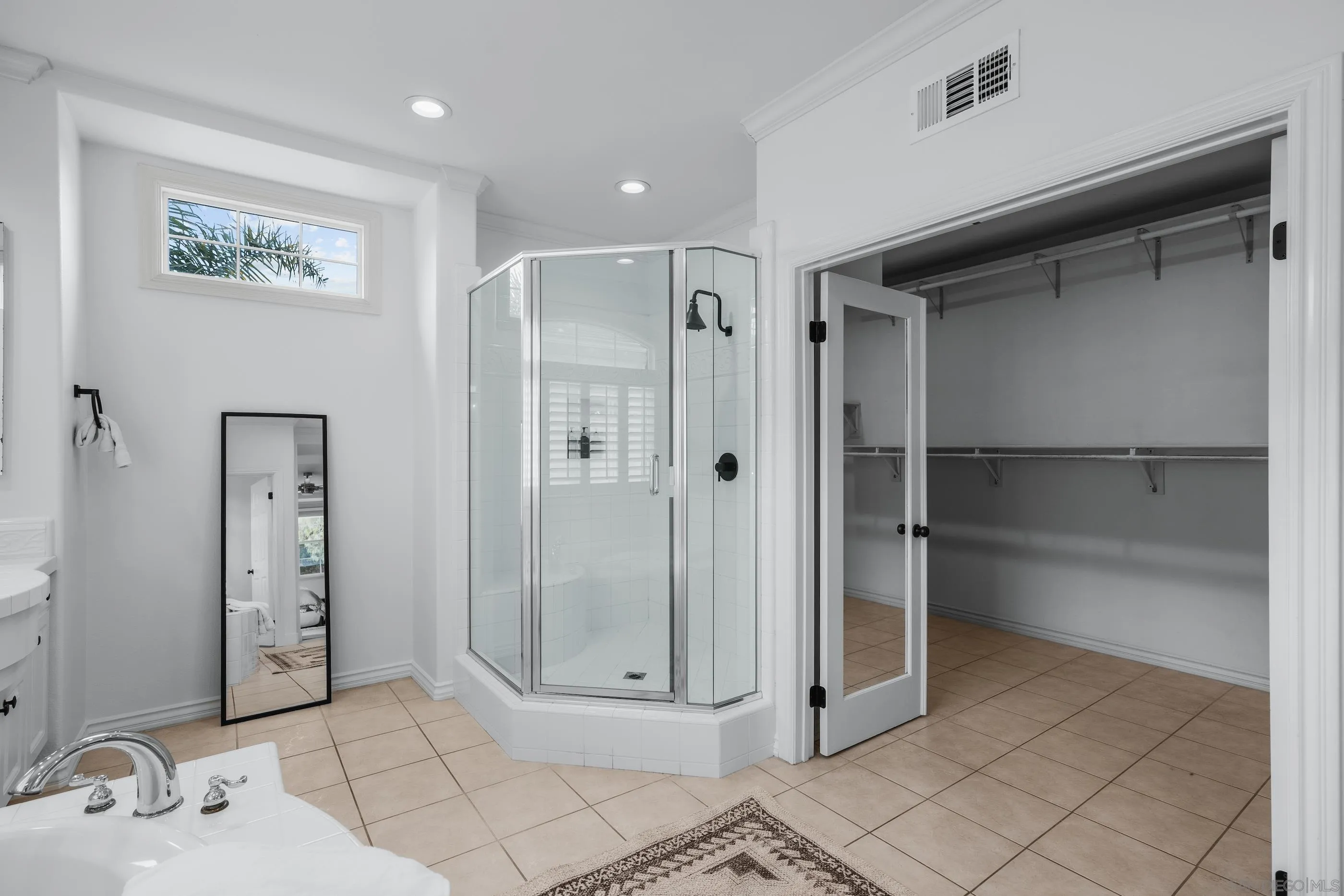 6402 Topmast Drive Carlsbad, CA 92011 - Photo 33 of 53 a bathroom with a shower and a sink