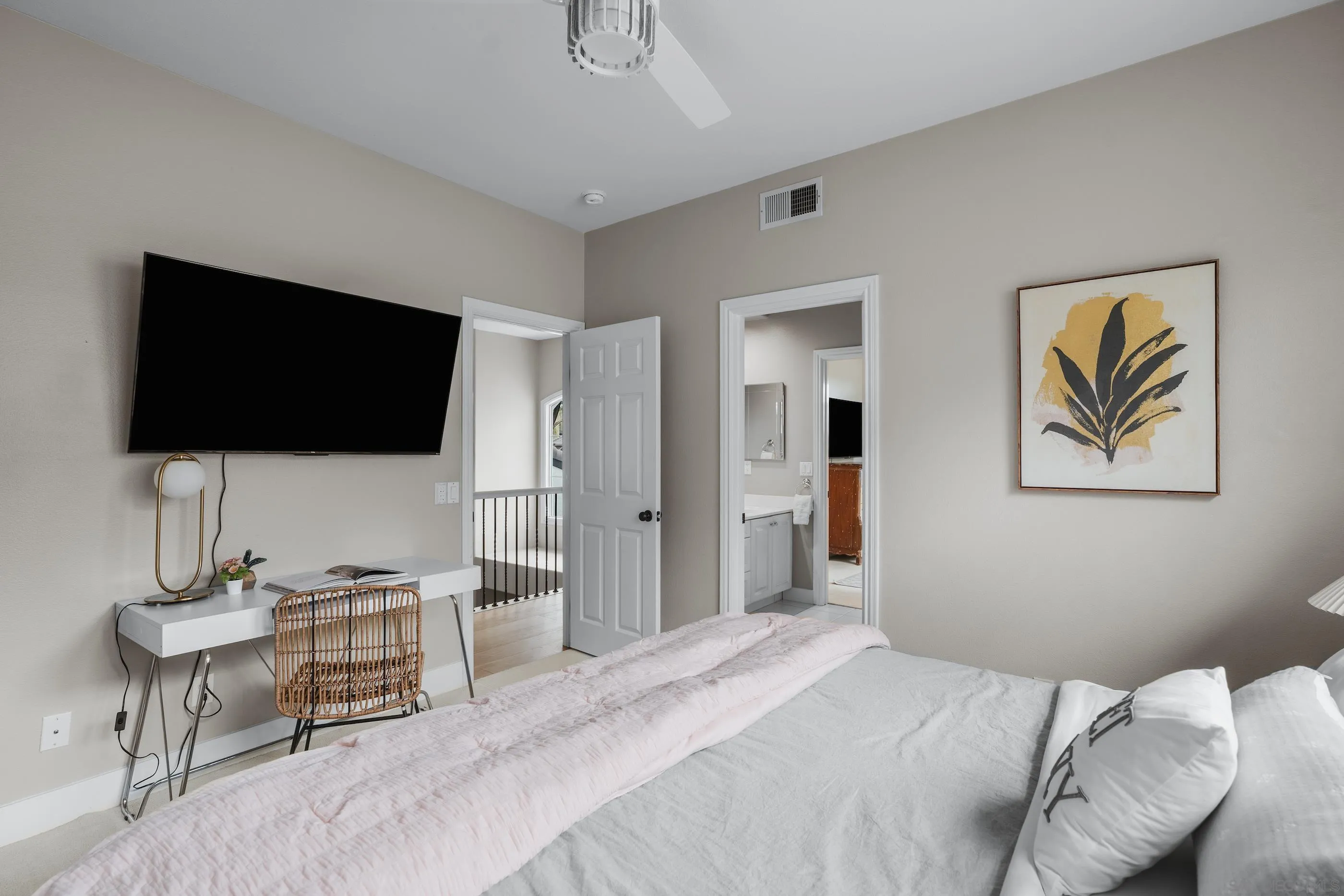 6402 Topmast Drive Carlsbad, CA 92011 - Photo 38 of 53 a bedroom with a bed and a flat screen tv