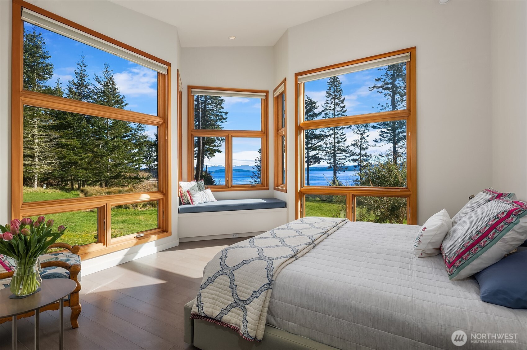 346 Thatcher Pass Road Decatur Island, WA 98221 - Photo 16 of 39 a bedroom with a large bed and a painting on the wall