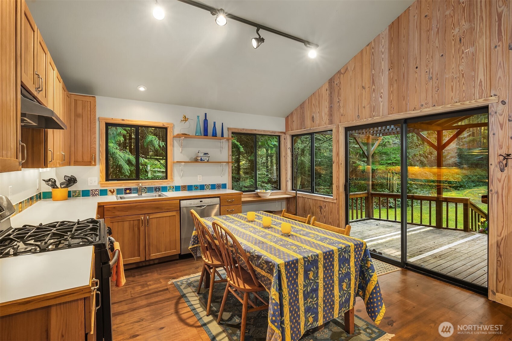 346 Thatcher Pass Road Decatur Island, WA 98221 - Photo 30 of 39 a kitchen with stainless steel appliances granite countertop a stove and a kitchen island