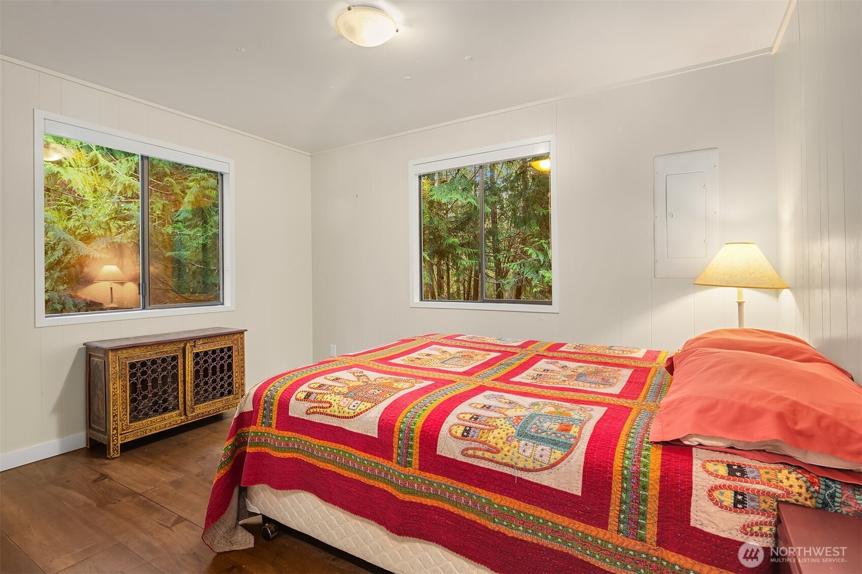 346 Thatcher Pass Road Decatur Island, WA 98221 - Photo 33 of 39 a bedroom with a bed and a stove next to a window