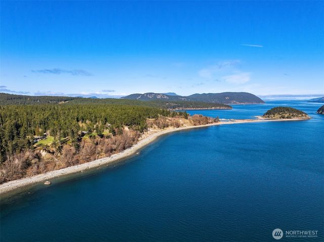 a view of city and lake with mountain