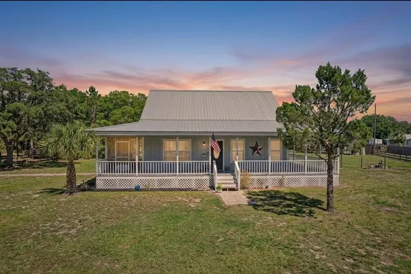 front view of a house with a yard