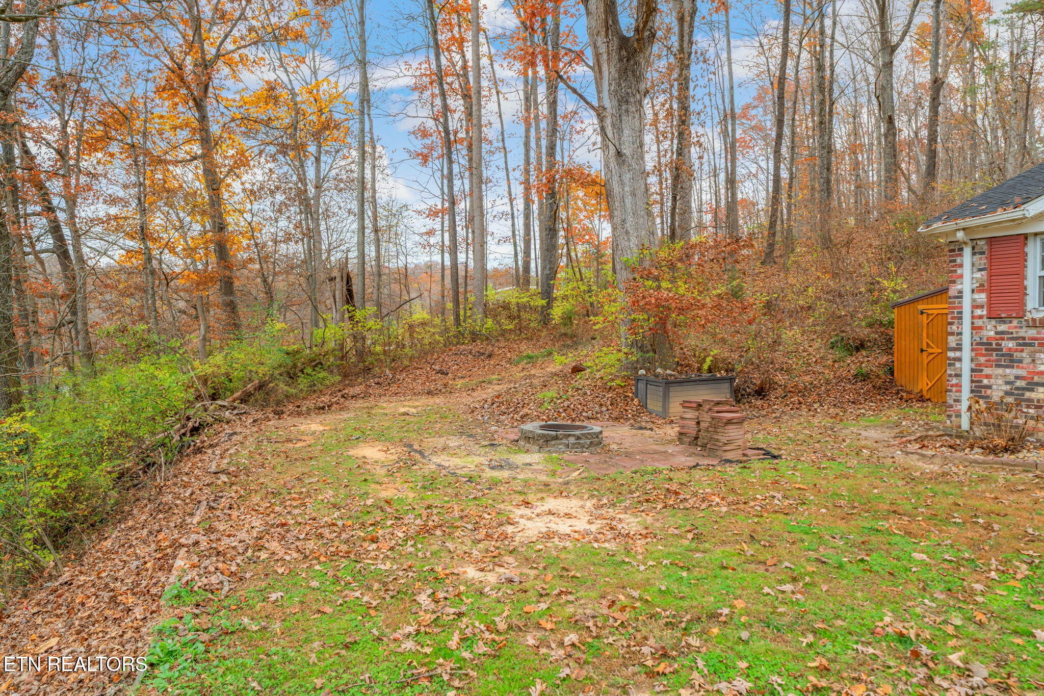 8404 Brickyard Road Powell, TN 37849 - Photo 12 of 49 a backyard of apartments with large trees