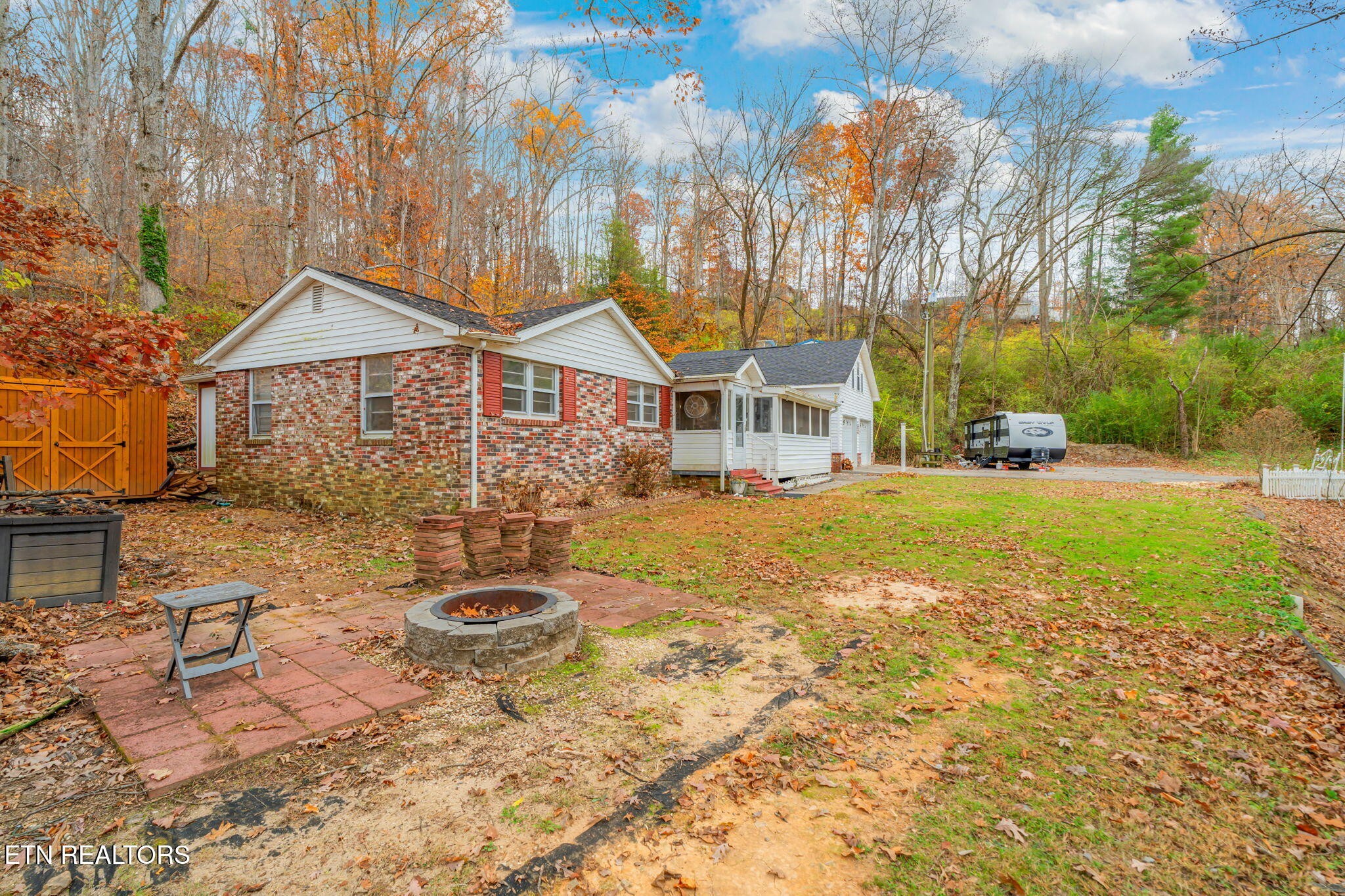 8404 Brickyard Road Powell, TN 37849 - Photo 13 of 49 a view of a house with backyard and sitting area