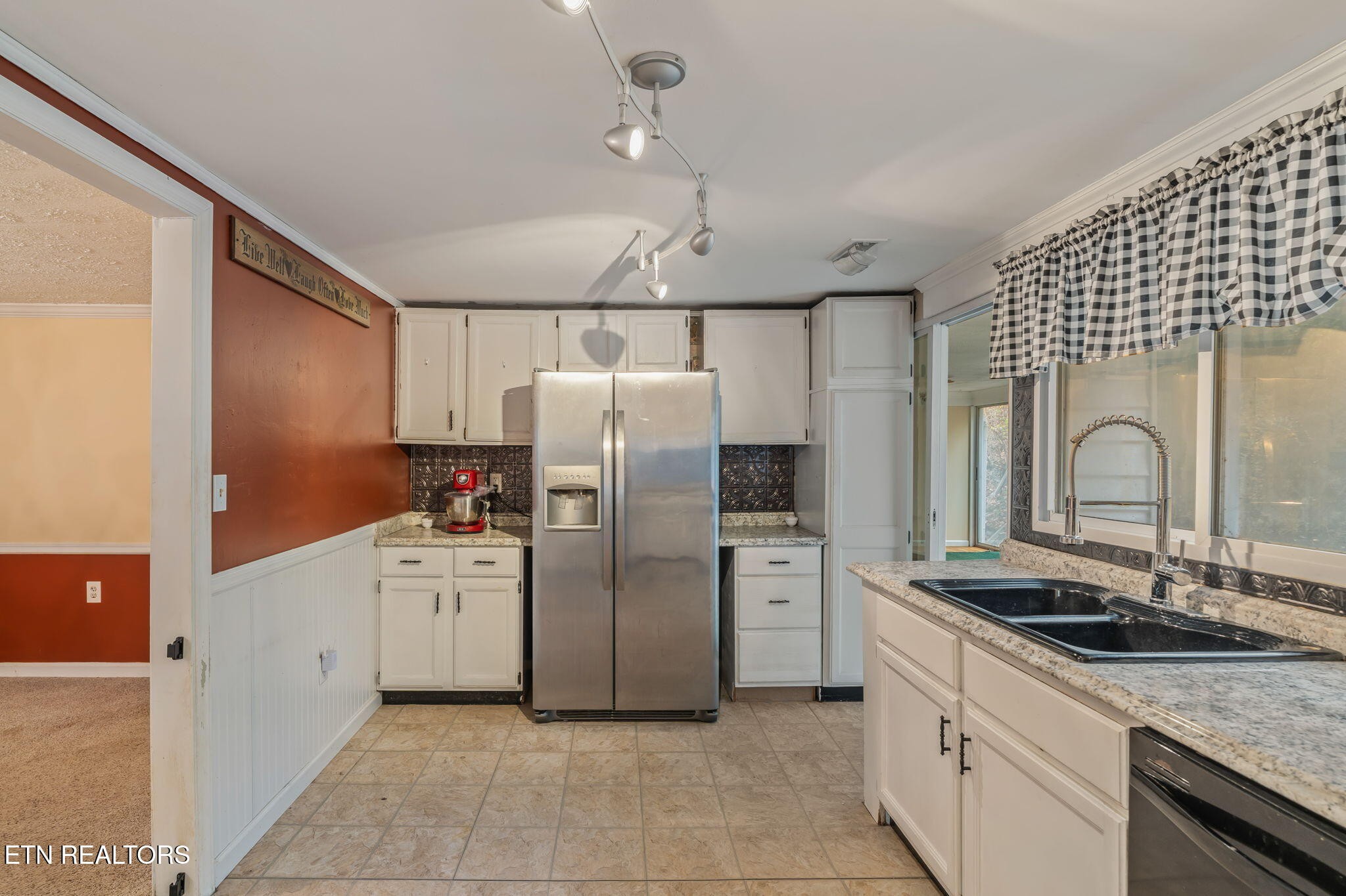 8404 Brickyard Road Powell, TN 37849 - Photo 23 of 49 a kitchen with refrigerator a sink and cabinets