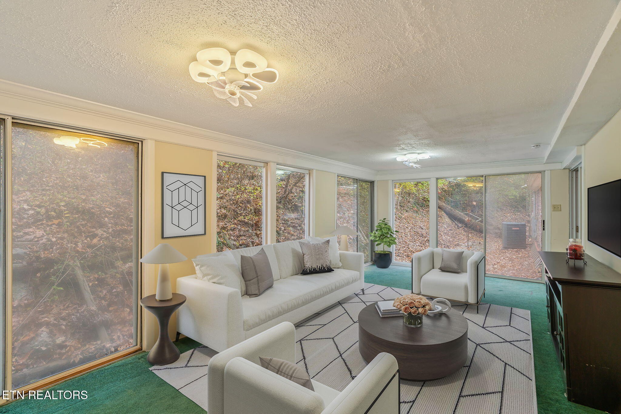 8404 Brickyard Road Powell, TN 37849 - Photo 25 of 49 a living room with furniture and a flat screen tv