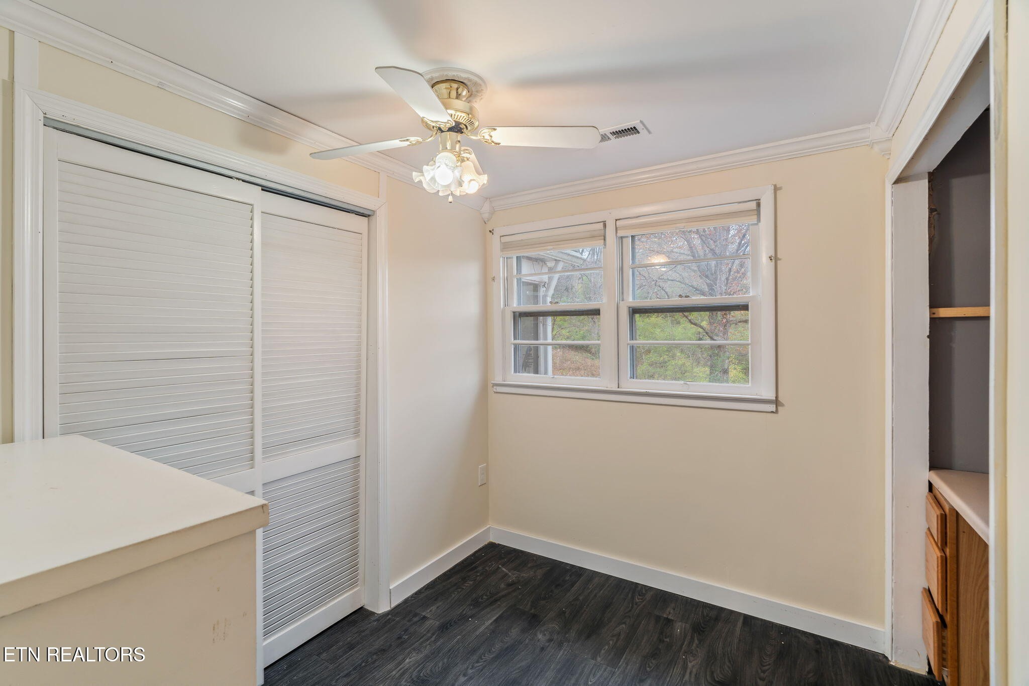 8404 Brickyard Road Powell, TN 37849 - Photo 27 of 49 a view of a livingroom with wooden floor and cabinet