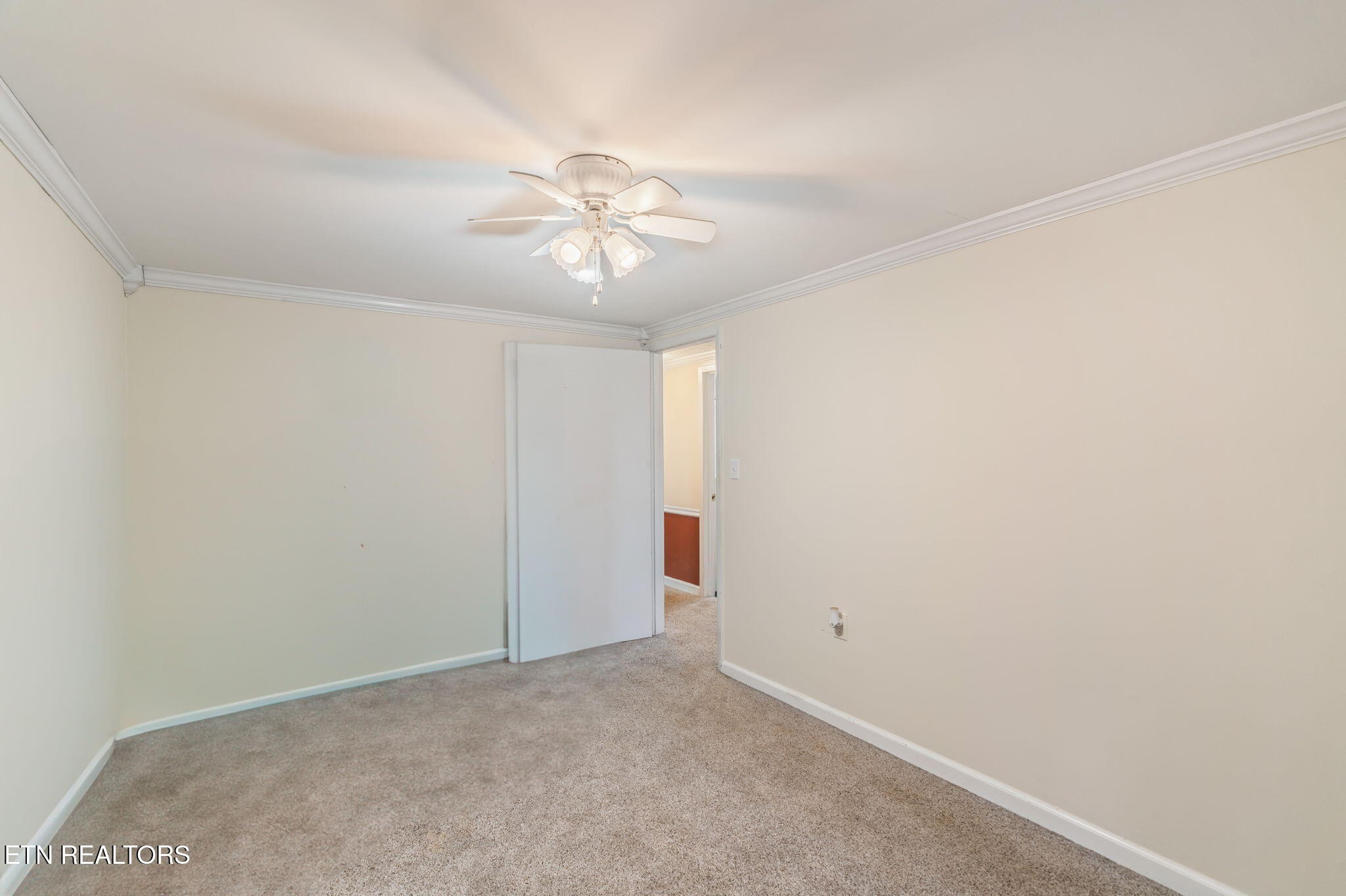 8404 Brickyard Road Powell, TN 37849 - Photo 30 of 49 an empty room with a chandelier fan and closet
