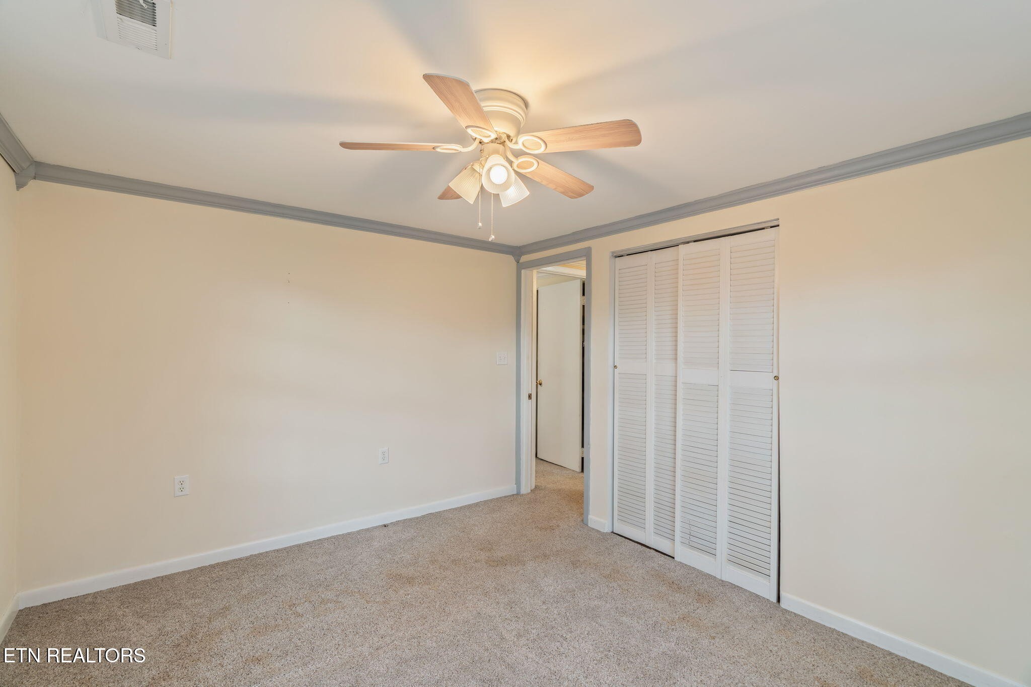 8404 Brickyard Road Powell, TN 37849 - Photo 33 of 49 a view of a livingroom with a ceiling fan and window