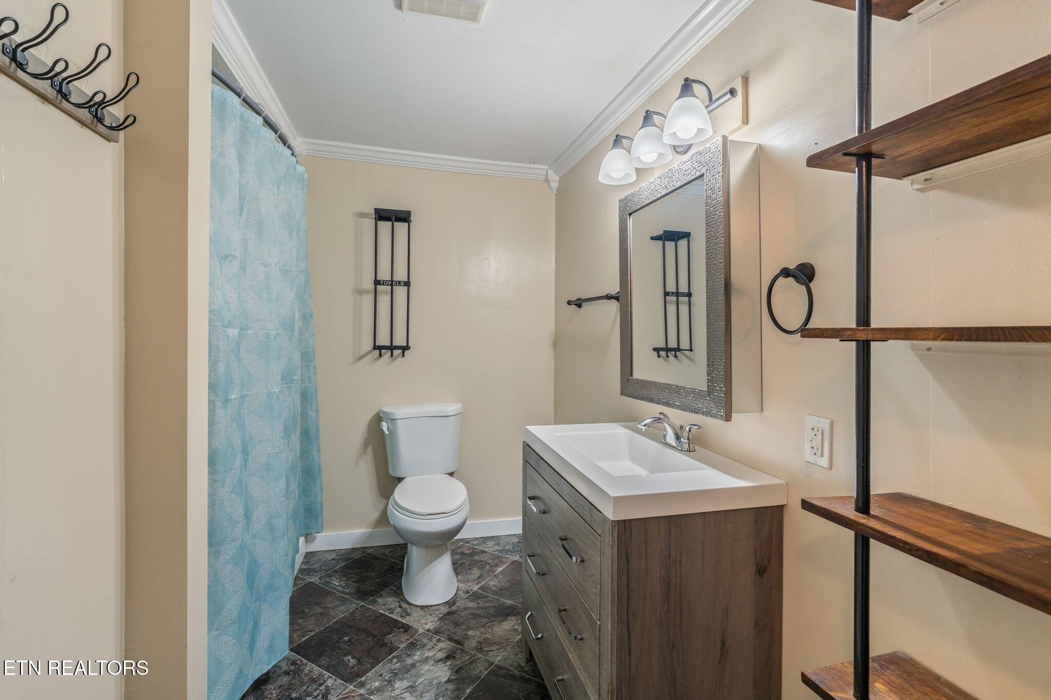8404 Brickyard Road Powell, TN 37849 - Photo 34 of 49 a bathroom with a sink toilet and shower