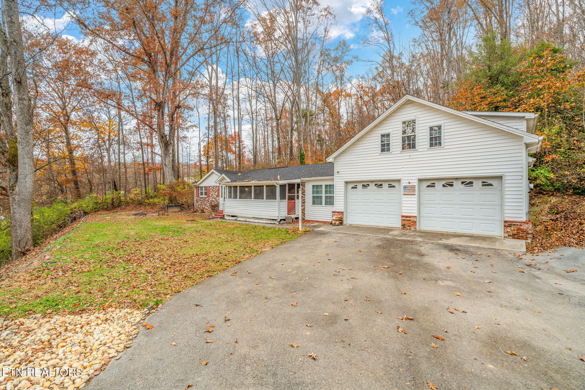 8404 Brickyard Road Powell, TN 37849 - Photo 6 of 49 a view of a house with a yard and large tree