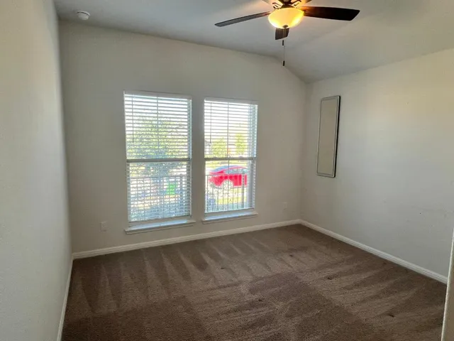 a bathroom with a sink a toilet a large mirror and shower