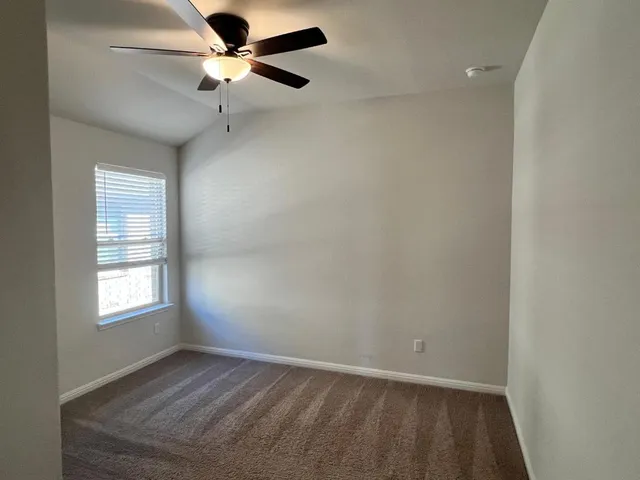 an empty room with closet area