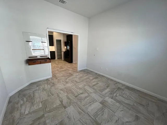 a view of an empty room and window